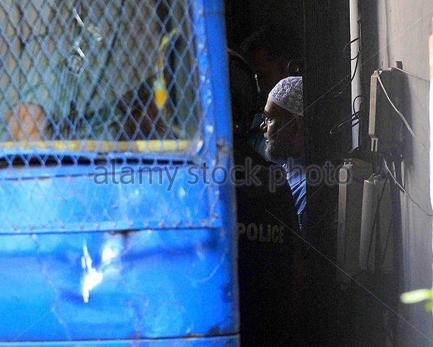 epa04473074-jamaat-e-islami-leader-mir-quasem-ali-c-is-escorted-to-ea0kc6